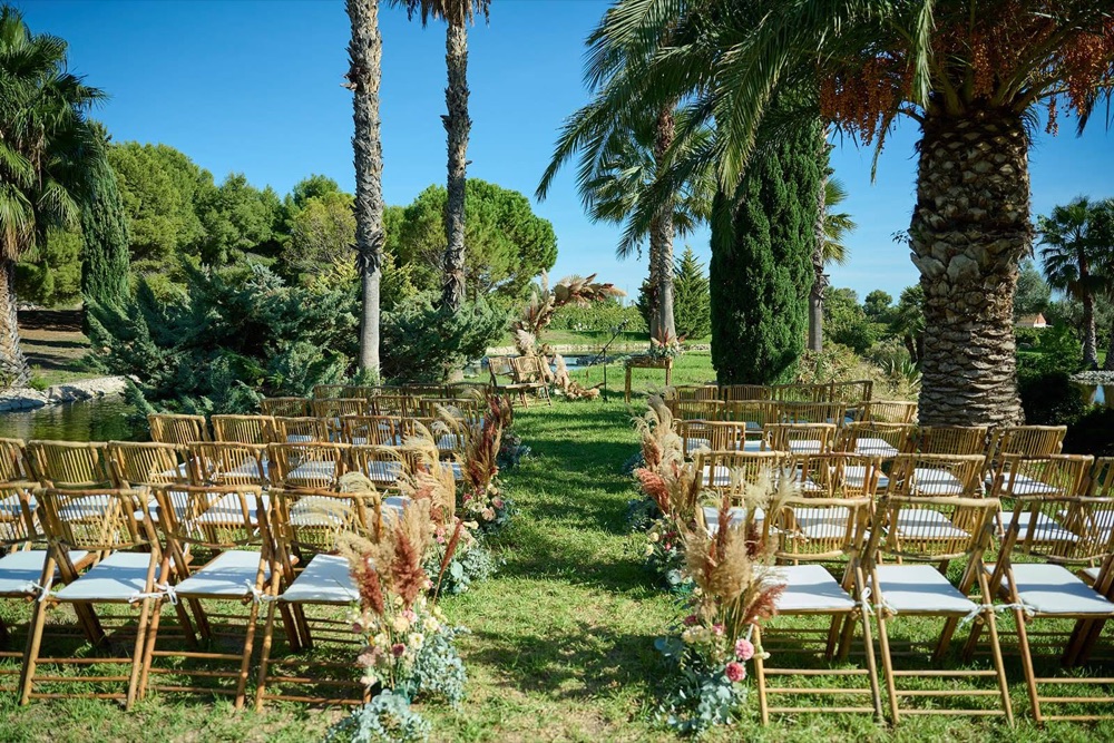 Tables set outdoors for a wedding banquet at Casa Imas
